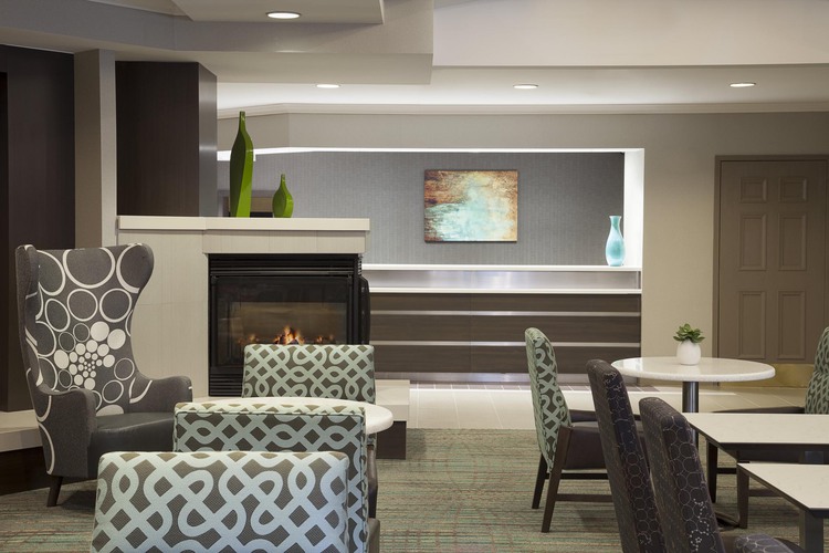 Chairs, tables, and fireplace in lobby